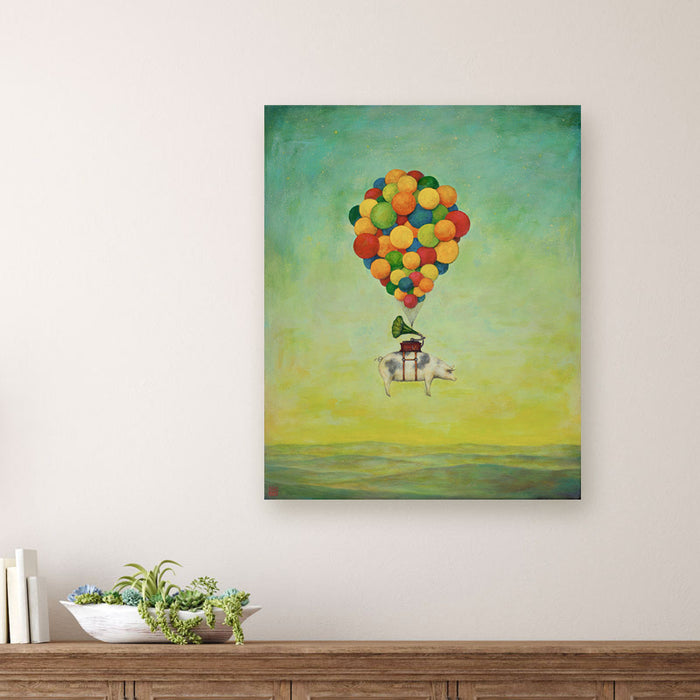 Suspension of Disbelief painting by Charlotte NC artist Duy Huynh. Surreal artwork of a pig, with a gramophone on its back, being carried through the sky by a cluster of colorful balloons. The background is a dreamy gradient sky transitioning from teal-blue to warm yellow and dark green mountain landscape below. Displayed over wood console table.