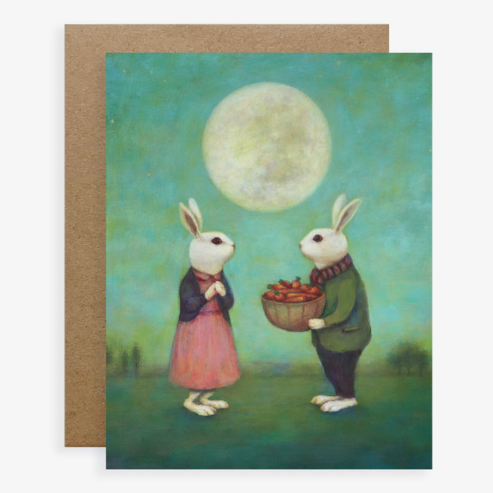 Duy Huynh notecard "18 Carrots for my Sweet". A male rabbit offers a female rabbit a basket of 18 carrots under a full moon. Card is blank inside.