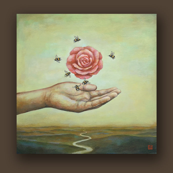 "Beeyond Grateful" painting by artist Duy Huynh. A hand reaches out over an open landscape, a pink camellia flower and six bees surrounding it hover above. 12 x 12 x 2" acrylic on wood. Artwork shown on a brown wall.