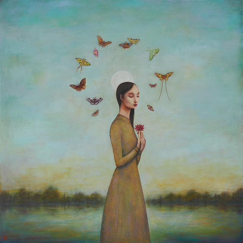 Art print of a woman in a golden yellow dress holding a flower with moths around her head against a scenic background with a full moon.