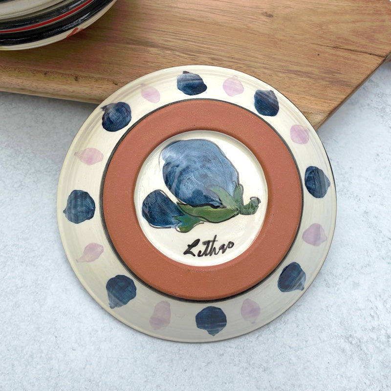 Handmade ceramic bowl with eggplant decoration by Molly Lithgo. Bottom view. 