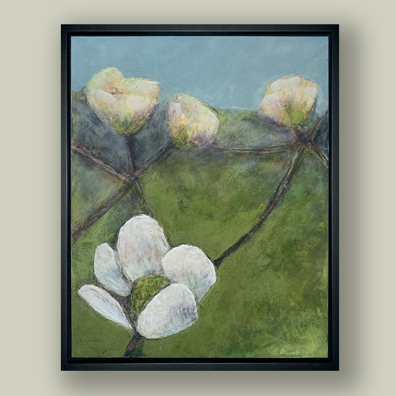 Oil and cold wax painting of dogwood flowers with green and blue background, framed in black and shown on pale green wall. Artwork by Elizabeth Davant at Lark & Key, Charlotte NC.