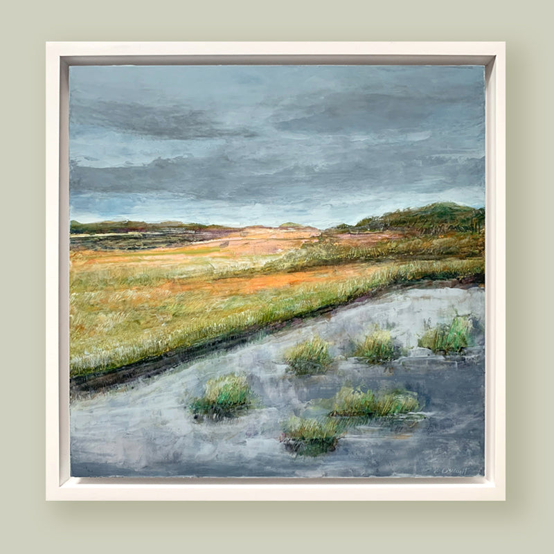 "Orange Dusk" oil and cold wax painting by Charlotte NC based artist Elizabeth Davant. 12 x 12" marsh landscape, set in a white floater frame. Shown on pale, muted green wall. 