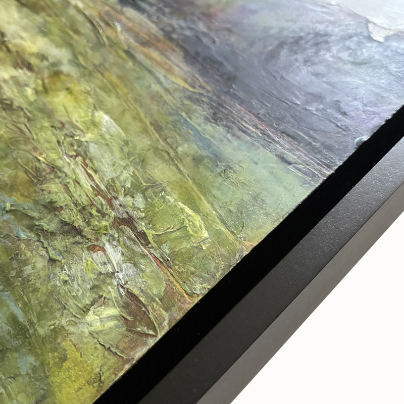 Detail and of painting and black frame.