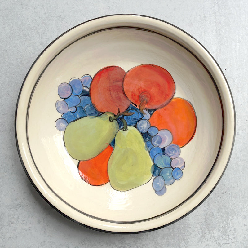 Handmade ceramic serving bowl with apple, pear and grape decoration by Molly Lithgo.