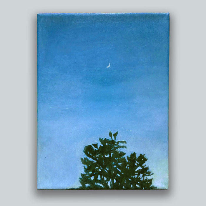 An oil painting, by Bridgette Guerzon Mills, depicting a blue at dusk with a small crescent moon  above the silhouette of a treetop. Showcased on light gray wall.