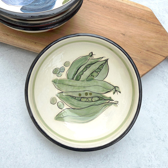 Handmade ceramic bowl with green peas in pods decoration on the interior by artist Molly Lithgo. 