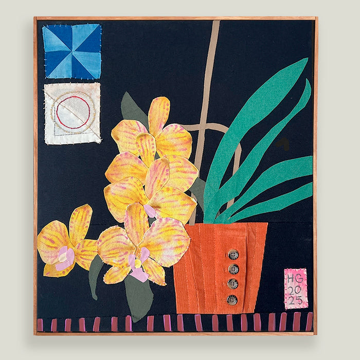 Yellow Orchids, Hannah Goff mixed media textile artwork. Orange flower pot with yellow orchid plant against black background with geometric details.  Displayed on light tan wall. 