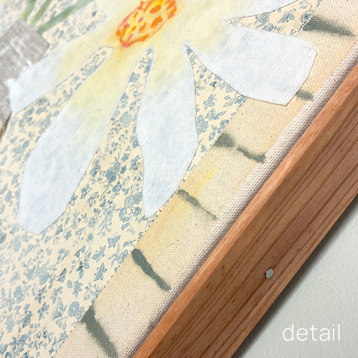 Patchwork Daisies by Hannah Goff, mixed media textile artwork with patchwork vase and white daisies. Close up wood frame detail.