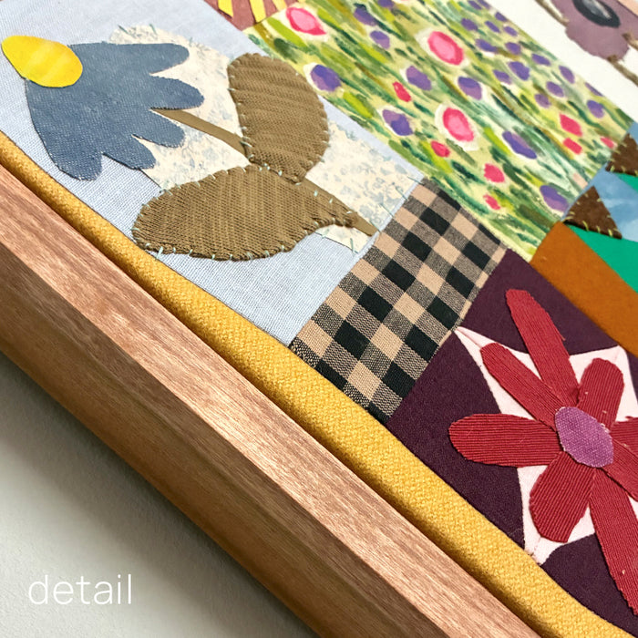 Poppy Patchwork, multicolored floral mixed media textile artwork by Hannah Goff with handmade wood frame. Detail with frame. 