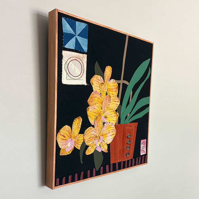 Yellow Orchids, Hannah Goff mixed media textile artwork. Orange flower pot with yellow orchid plant against black background with geometric details. Side view on wall. 