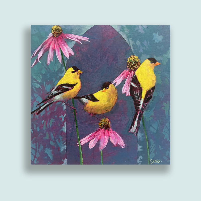 Colorful acrylic painting by Hannah Seng featuring three goldfinches perched on pink coneflowers against a textured blue and purple botanical background. Artwork displayed on pale blue wall.