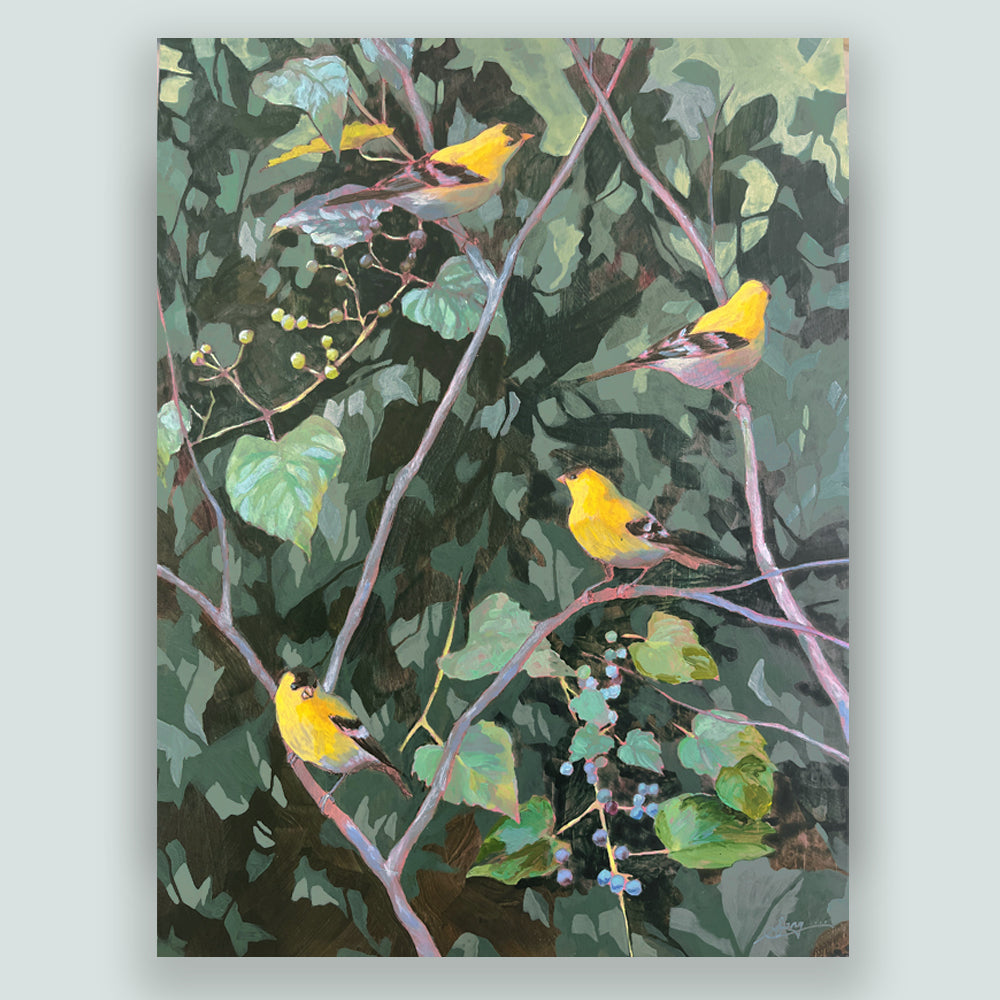 Hannah Seng's "In This Family Tree" painting, four yellow goldfinches perched among bitter vine branches with green foliage. Shown on pale blue wall.