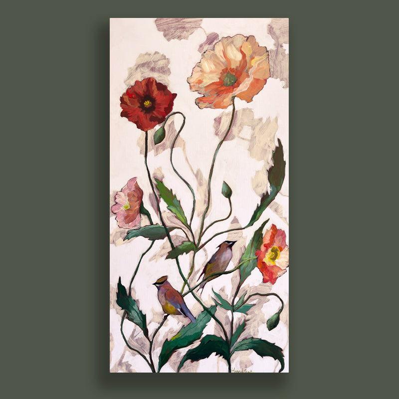 A vertical, acrylic on wood painting by Hannah Seng. Two waxwing birds perched among poppy flowers in reds, pink and orange with a pale pink background. Artwork displayed on dark green wall.