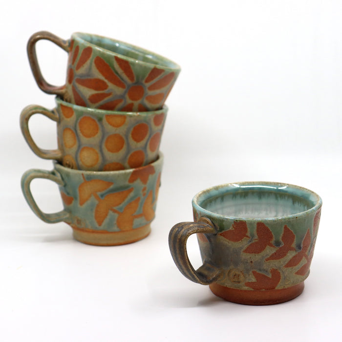 Handmade, wood-fired stoneware mugs by Heather Ossandon.