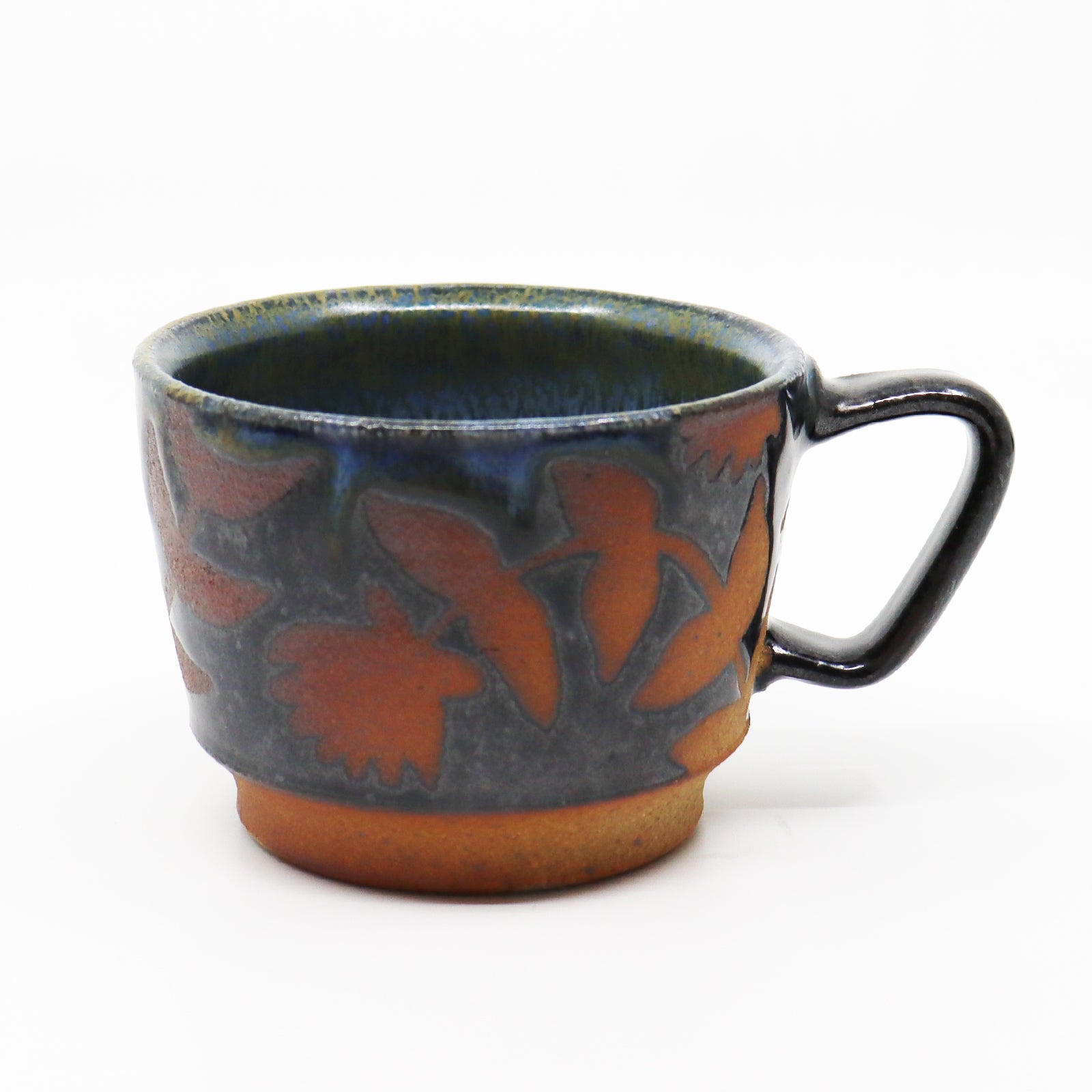 Handmade, wood-fired stoneware mug with botanical pattern by Heather Ossandon.