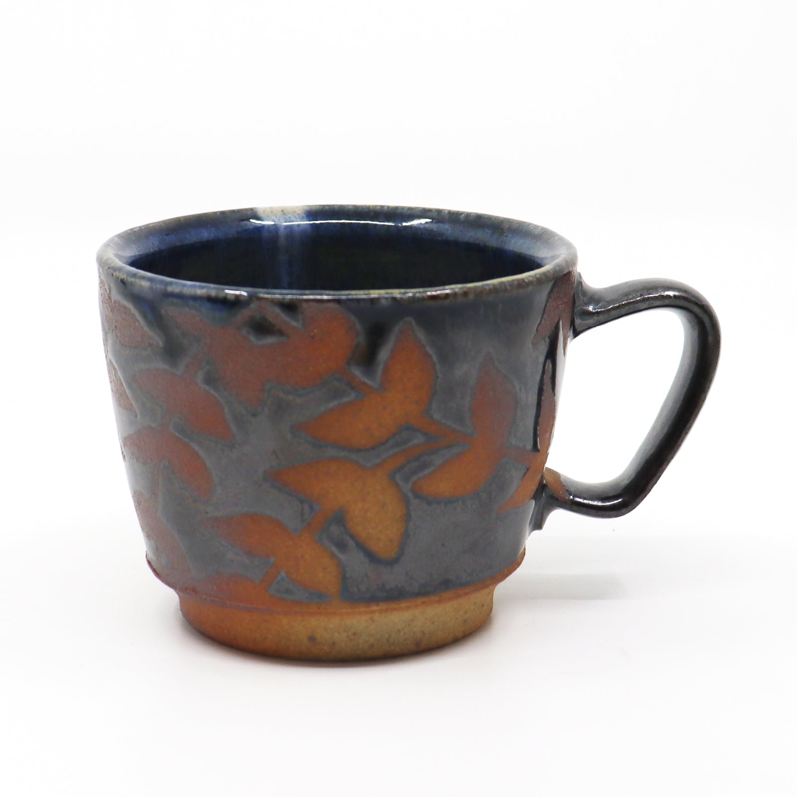 Handmade, wood-fired stoneware mug with botanical pattern by Heather Ossandon