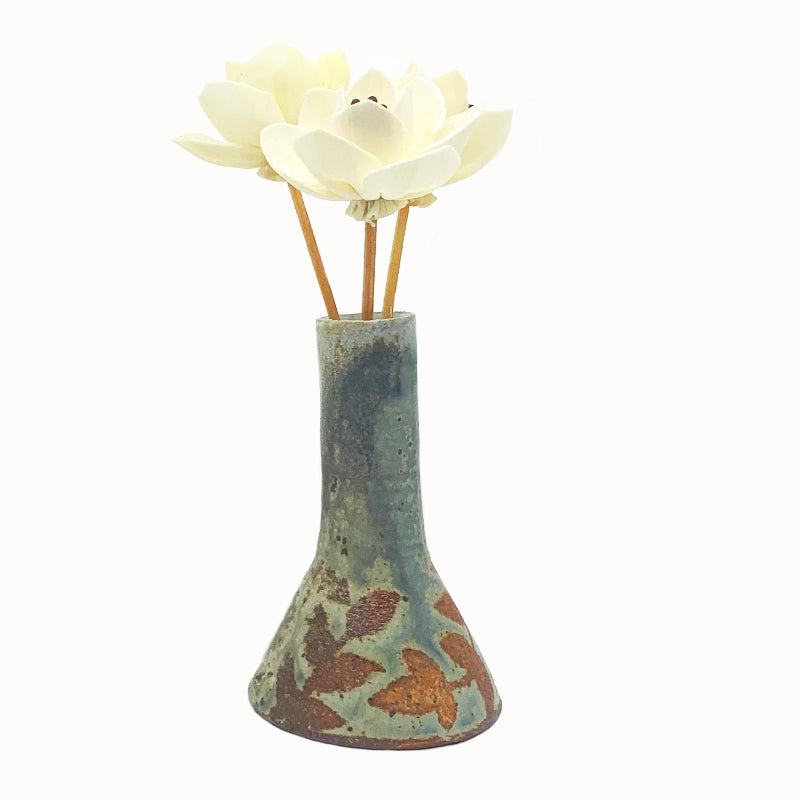 Wood-fired bud vase with wax resist botanical pattern by Heather Ossandon. 