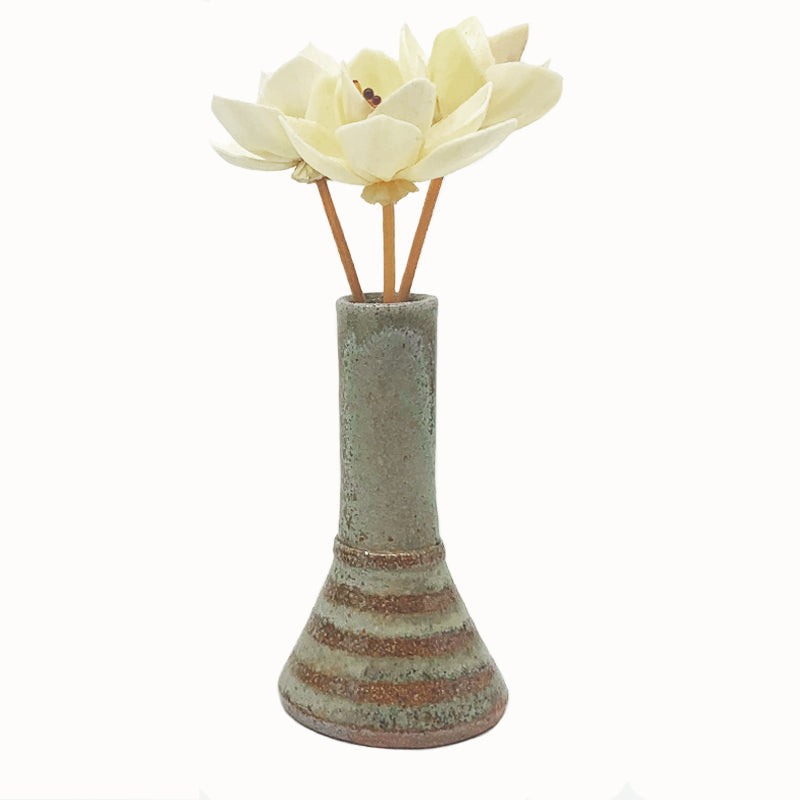 Wood-fired bud vase with wax resist stripe pattern by Heather Ossandon. 