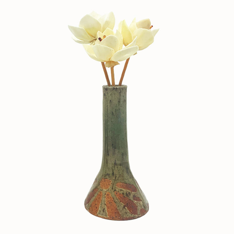Wood-fired bud vase with wax resist flower pattern by Heather Ossandon. 