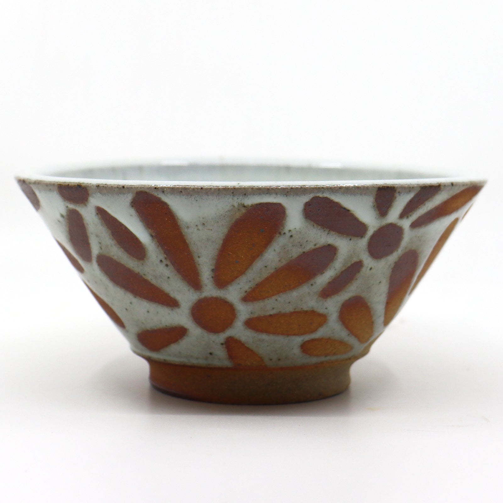 Handmade, wood-fired stoneware bowl with flower design by Heather Ossandon