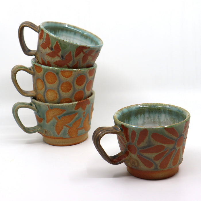 Handmade, wood-fired stoneware mugs by Heather Ossandon.