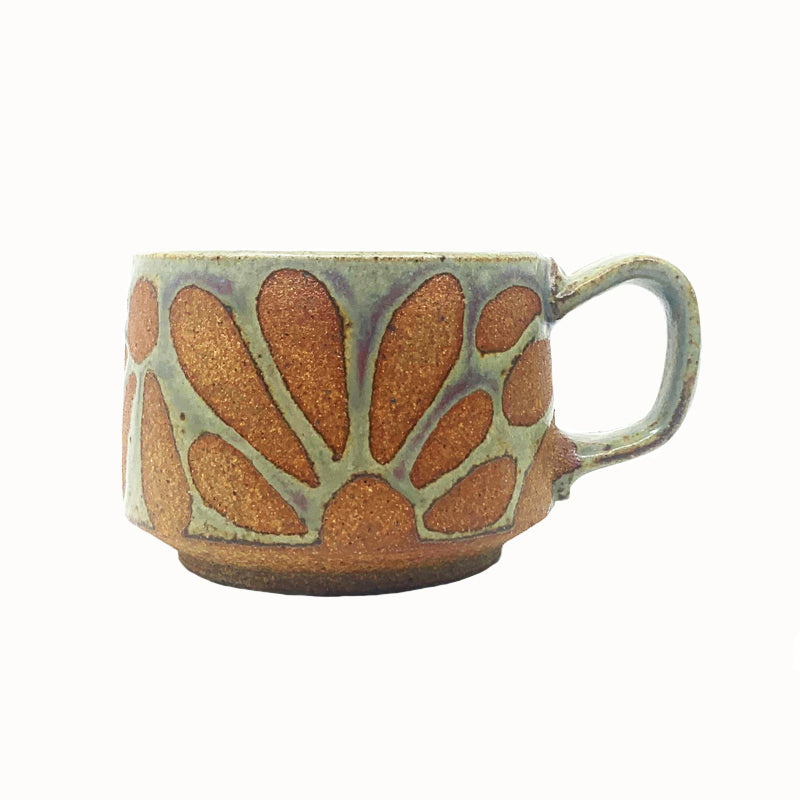 Woodfired creamic mug by Heather Ossandon, earthy hues with rust flower pattern.