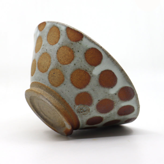 Handmade, wood-fired stoneware bowl with polka dots by Heather Ossandon