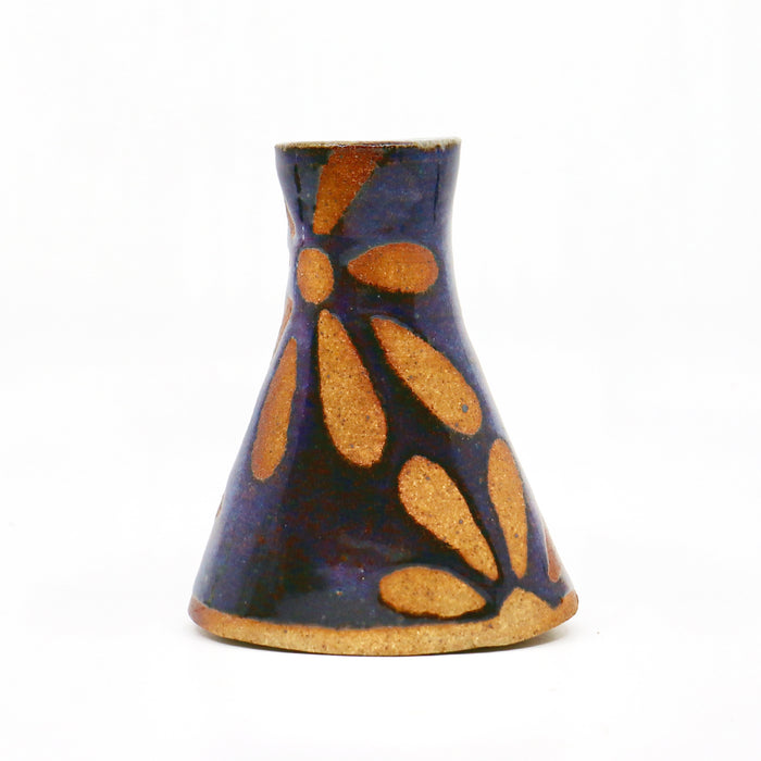 Wood fired ceramic bud vase with flower pattern.