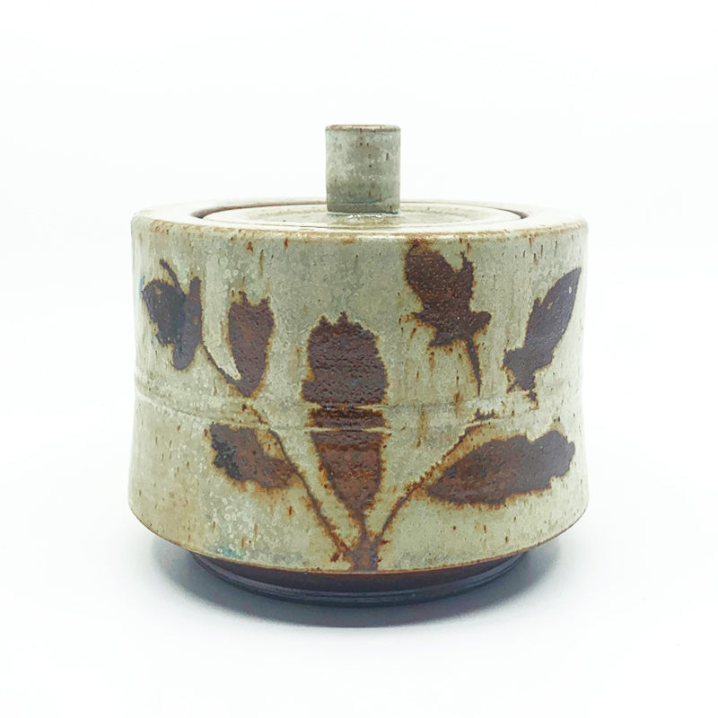Wood-fired stoneware canister by Heather Ossandon. Cream with rusty brown botanical pattern. 