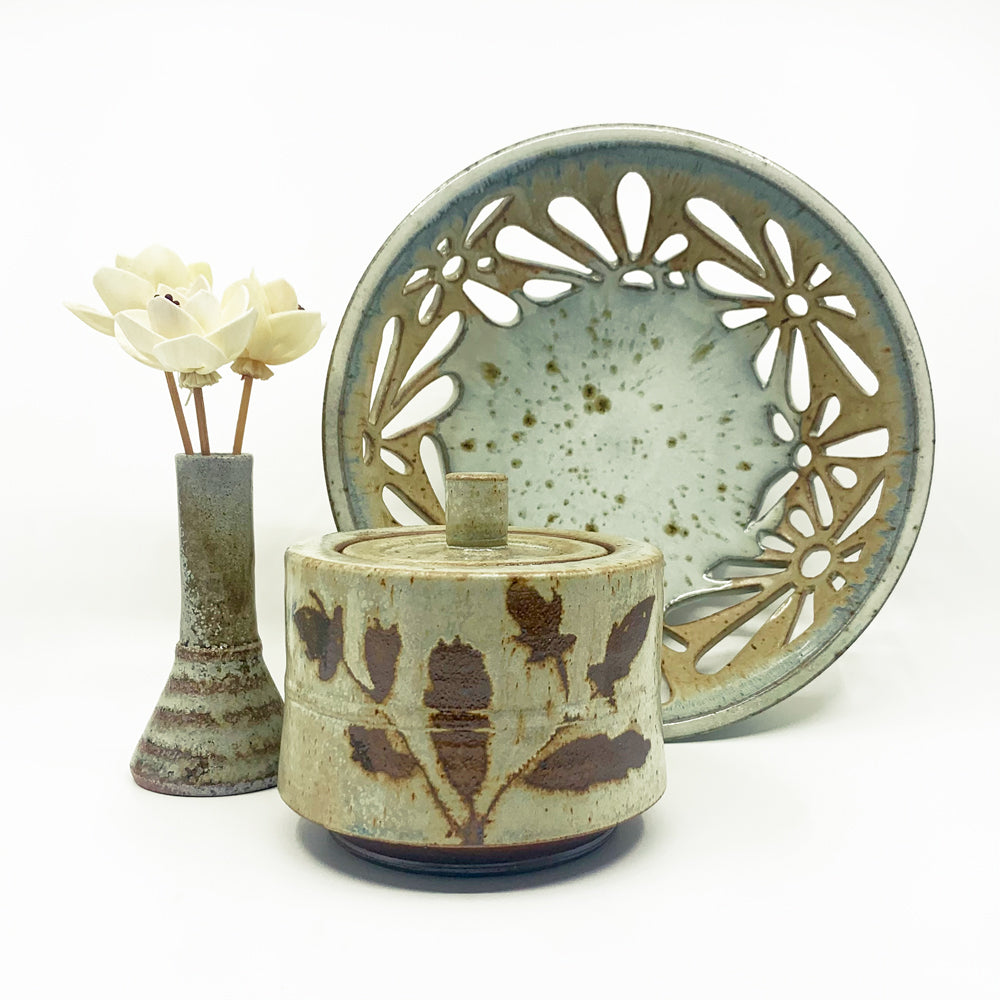 Heather Ossandon woodfired ceramics - a bud vase, fruit bowl and lidded canister in earthy hues.