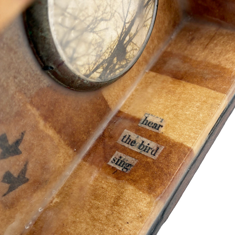 Building a Nest, a mini mixed media assemblage artwork by Janet Eskridge.  Interior detail showing the words 'hear the bird sing'.