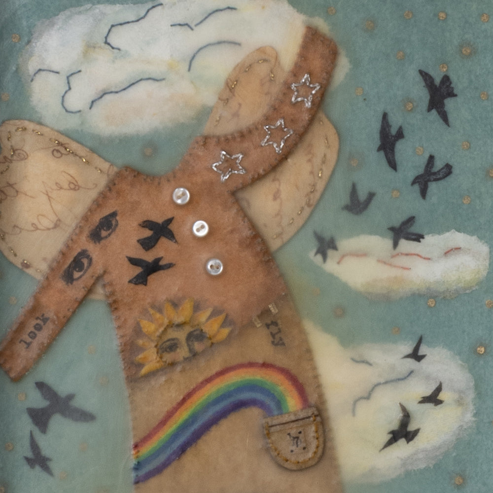 Detail of "With Wings" mixed media encaustic assemblage art by Janet Eskridge. Artwork set inside a wood box with finial.