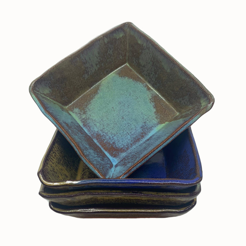 Small, multicolor square bowl by potter Jim Rientjes. Earthy tones and vibrant blues.