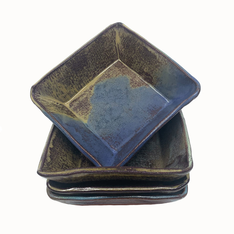 Small, multicolor square bowl by potter Jim Rientjes. Earthy tones and vibrant blues.