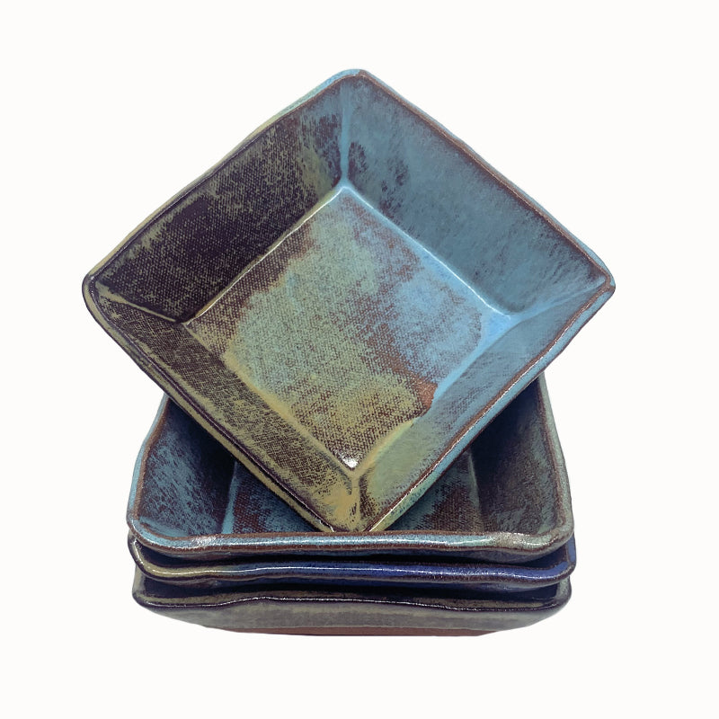 Small, multicolor square bowl by potter Jim Rientjes. Earthy tones and vibrant blues.