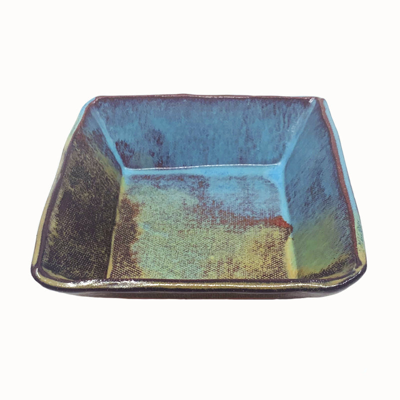 Small, multicolor square bowl by potter Jim Rientjes. Earthy tones and vibrant blues.