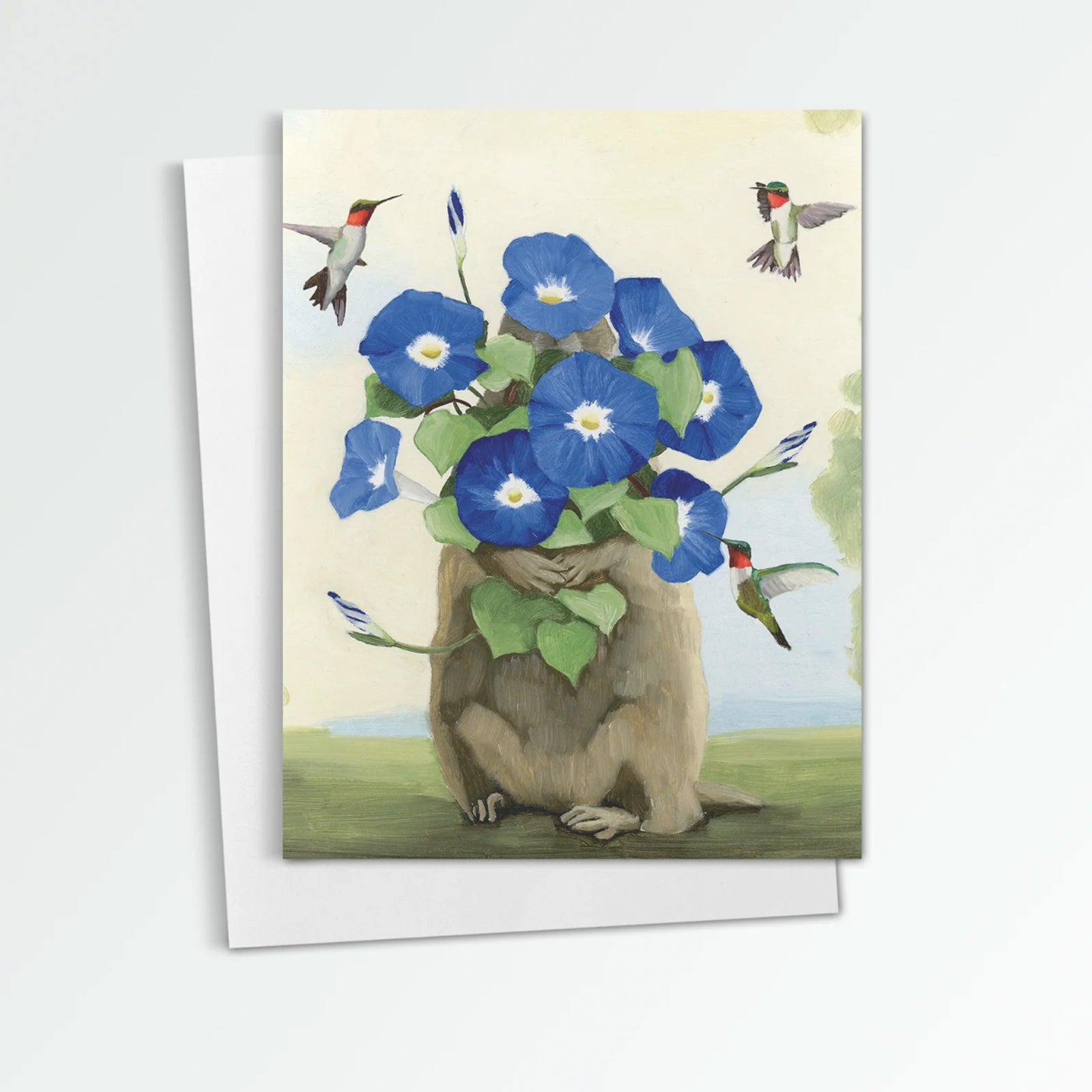 Groundhog with Morning Glories notecard from Kim Ferreira. A groundhog hold blue morning glory flowers and ruby throated hummingbirds fly around.