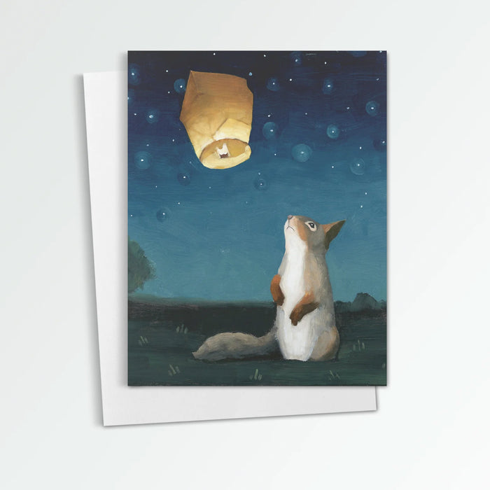 L is for Light & Letting Go notecard from Kim Ferreira. A squirrel looks up at a wish lantern floating in the night sky.