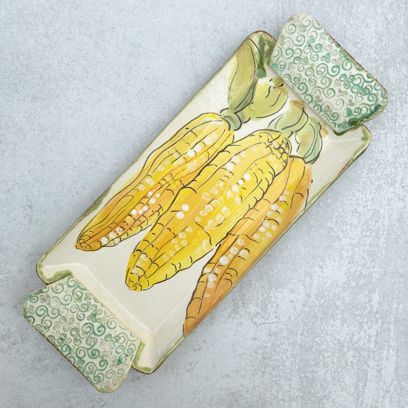 Handmade ceramic serving tray by Molly Lithgo with corn on the cob decoration. 