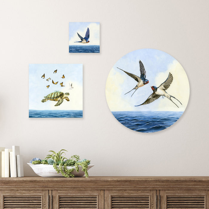 Kim Ferreira paintings with swallows and a sea turtle over the ocean