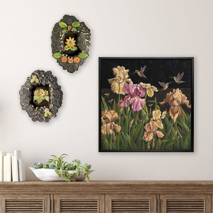 Handmade ceramic niches with flower details, and "After Hours Garden Party" yellow and pink iris night themed painting by Ninalee Irani. The painting includes bees and hummingbirds. Artwork from Lark & Key gallery's "Wallflowers" exhibit.