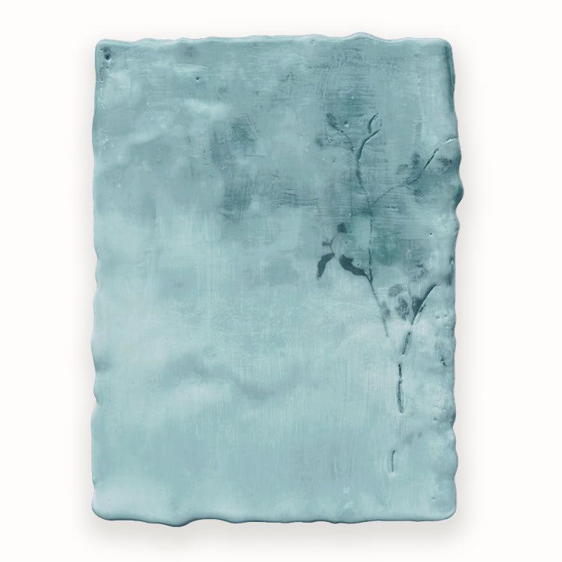 Mixed media encaustic painting by Liberty Hanson Wild in soft blue greens with leafy branch detail.