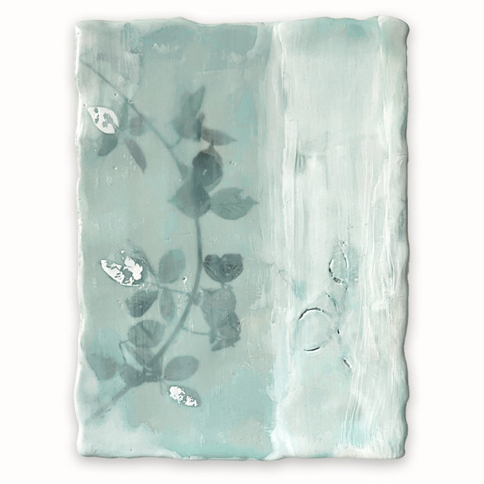 Mixed media encaustic painting by Liberty Hanson Wild in soft green and white with leafy branch and silver leaf detail.