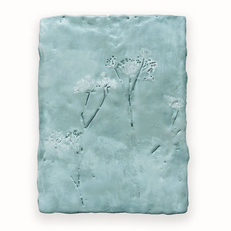 Mixed media encaustic painting by Liberty Hanson Wild in soft blues with  embossed botanical detail. 