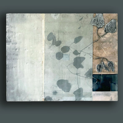 Mixed media encaustic artwork from Liberty Hanson-Wild's series called Yesterday's Seeds.  An abstracted background in neutral colors, textures and leaf pattern with silver.  Painting shown on dark teal wall. 