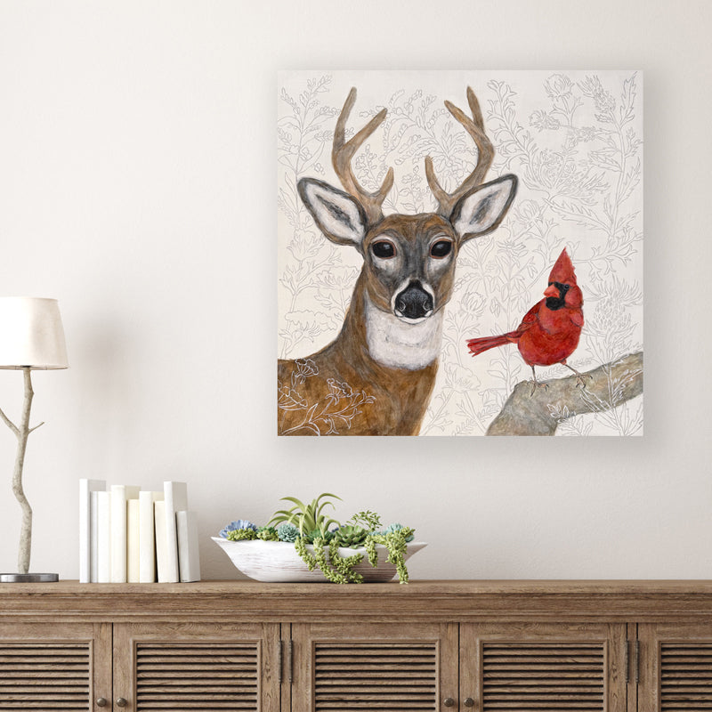 "Forest Wisdom" by artist Martha Worthy. Acrylic painting of a deer and a cardinal, with botanical details in the background and foreground. Shown on white wall.