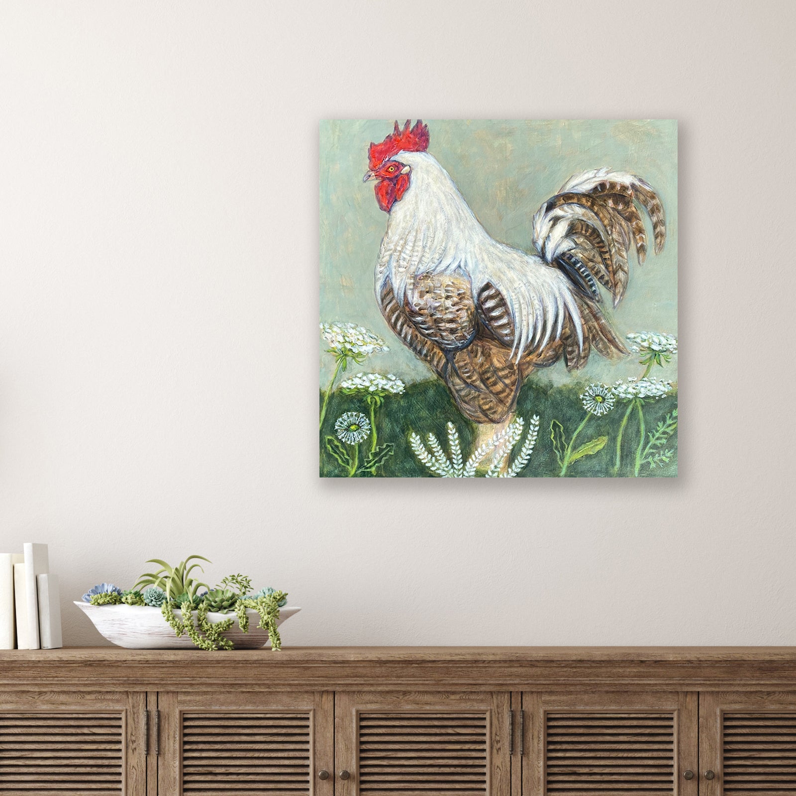 Rooster with Dandelions painting by Martha Worthy displayed over a table.