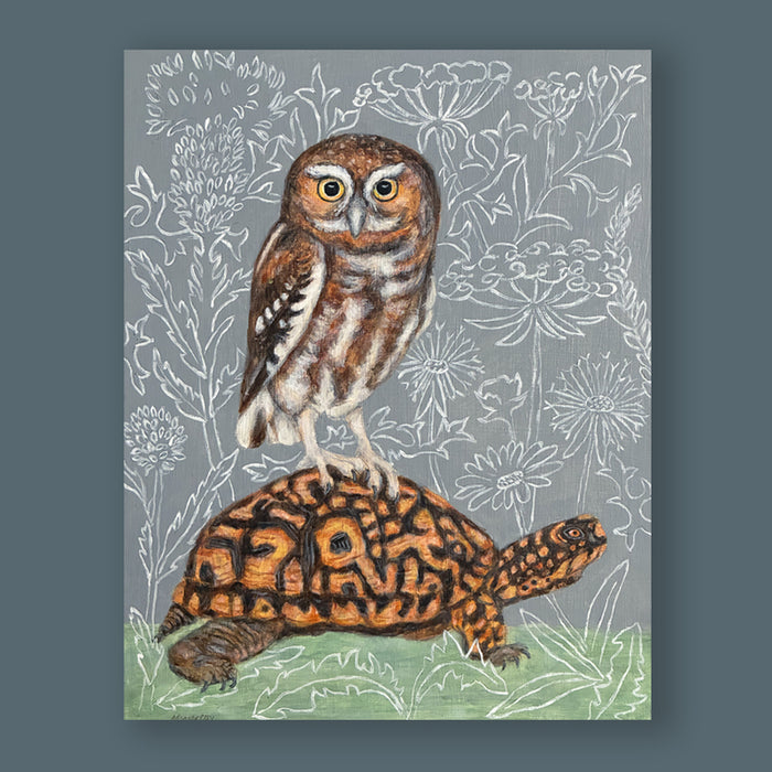 The Travelers painting by Martha Worthy featuring a box turtle with an elf owl on its back, and a botanical themed backdrop. Artwork showcased on a blue wall.