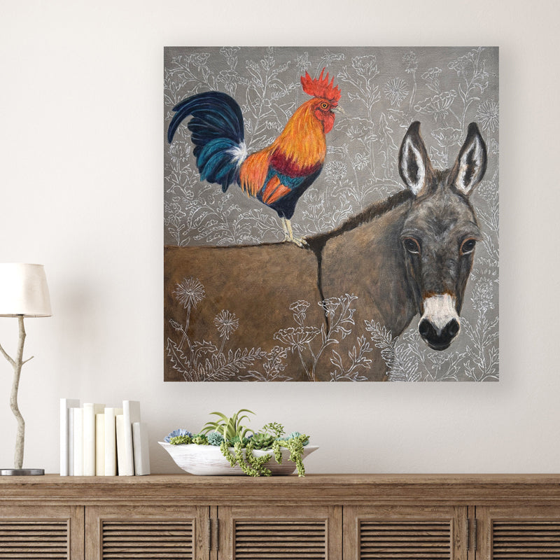 "The Wanderers" by artist Martha Worthy. Acrylic painting of a rooster standing on a donkey's back, with botanical details in the background and foreground. Shown on white wall.